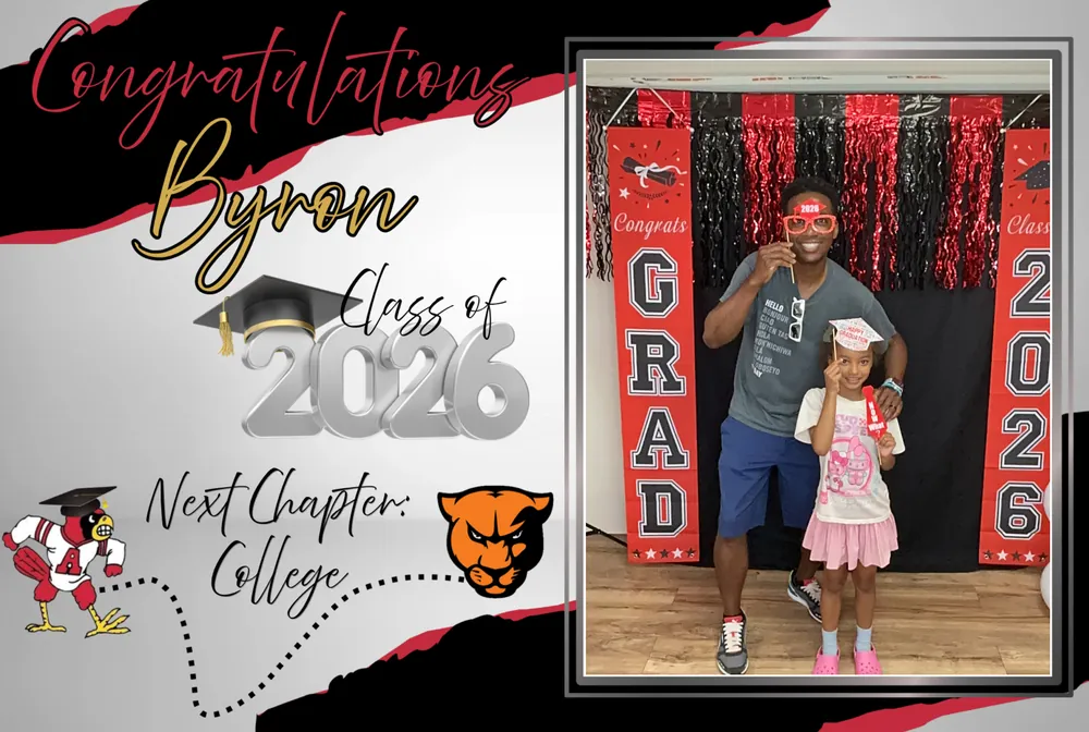 Graduate and young guest posing in a custom Class of 2026 photo booth frame