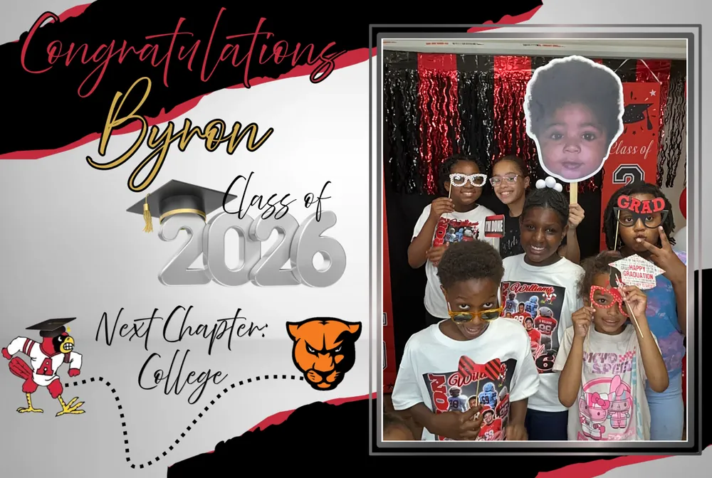 Family group posing with oversized face props in a graduation photo booth