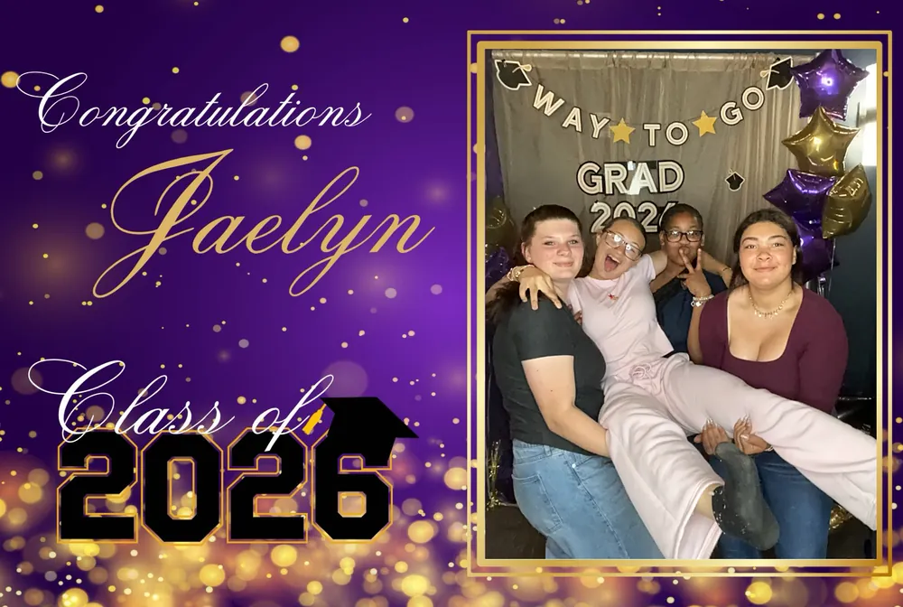Graduates and friends celebrating together in front of a Way to Go Grad backdrop